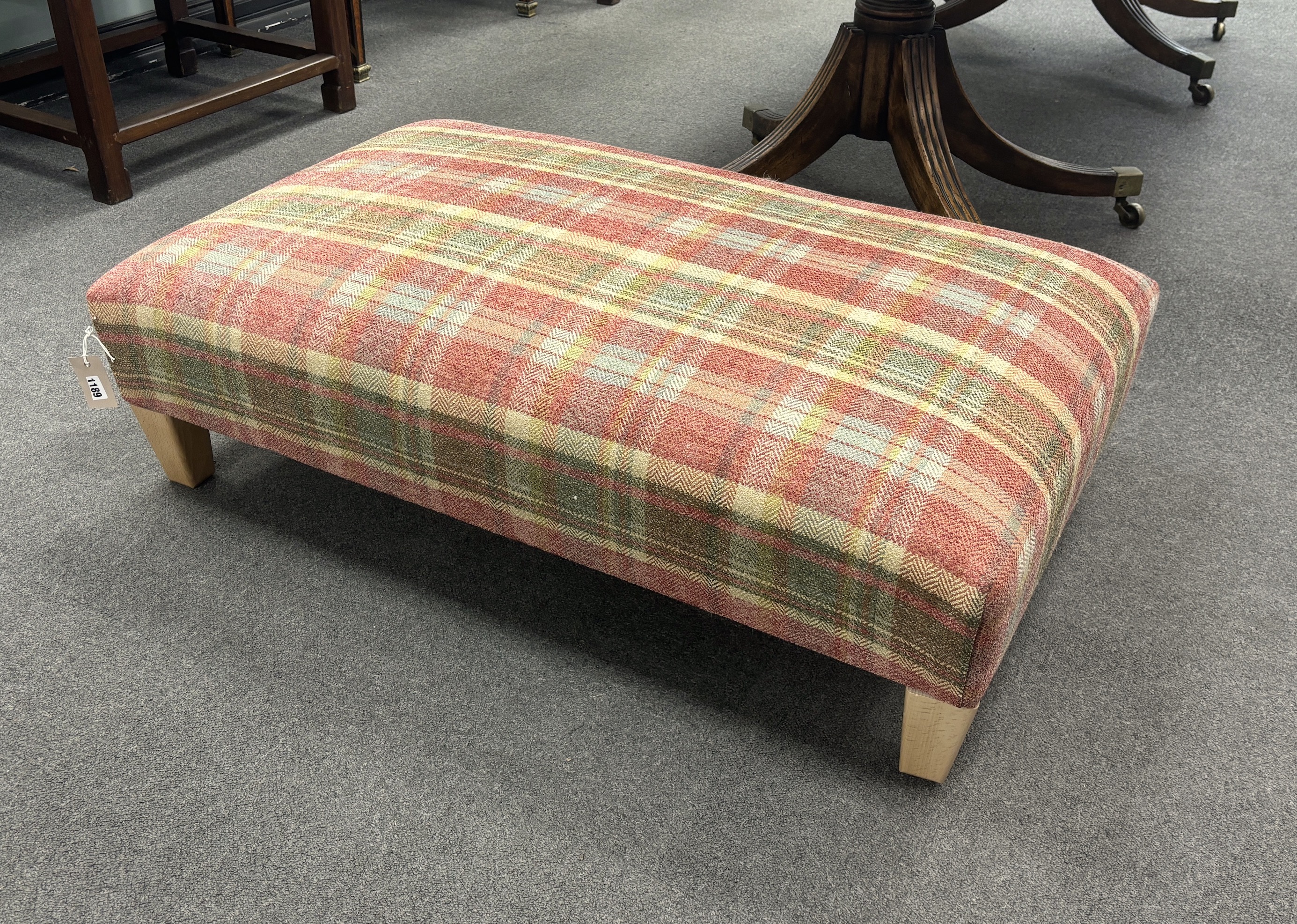 A contemporary rectangular footstool upholstered in Colefax and Fowler Magnus plaid, width 103cm, depth 63cm, height 32cm